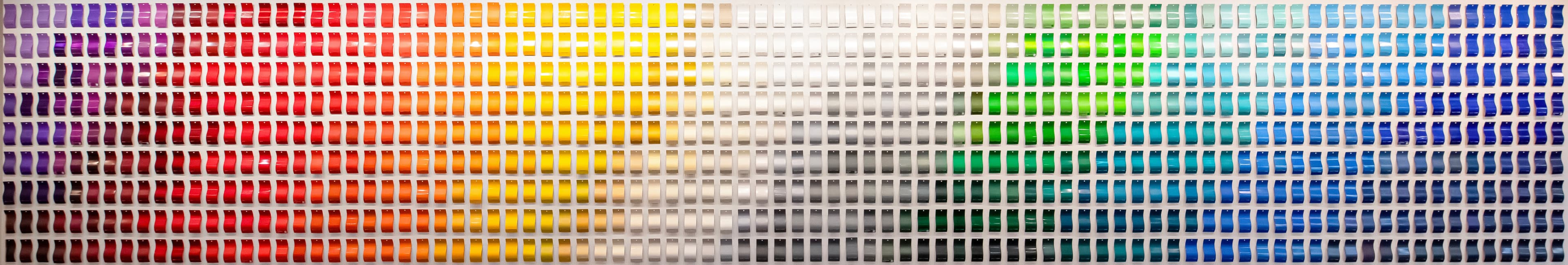 A vibrant collection of powder coating color swatches