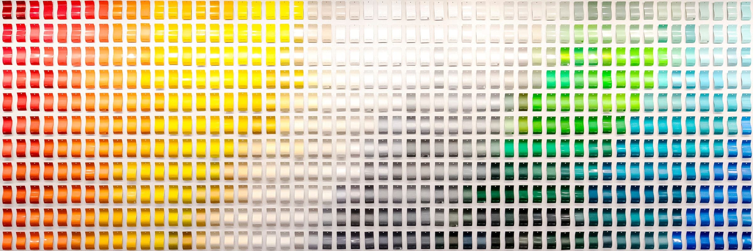 A vibrant collection of powder coating color swatches